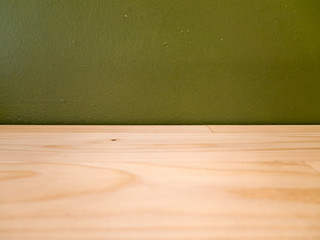 wood table texture and green wall use for background