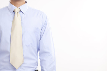 Midsection of businessman in shirt and tie against white background