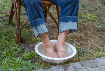 elderly feet having footbath