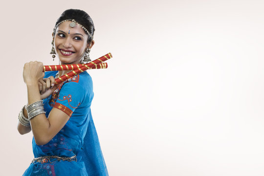 Gujarati woman performing dandiya 