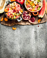 Tropical food . Fresh tropical fruit salad in bowls.