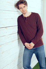 Portrait of a handsome man on old wooden background