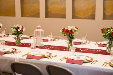 Burgundy and white table set. Birthday and anniversary dinner. Celebration