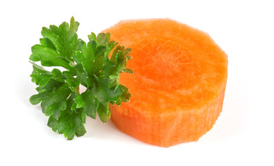 Chopped carrot slices and parsley herb leaves isolated on white background