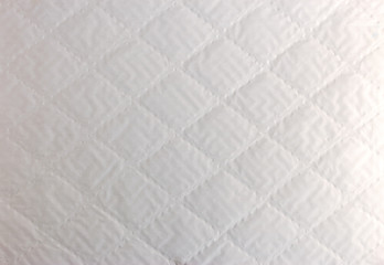 abstract background texture of white bumpy paper with rhombus pattern