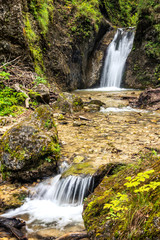 Double waterfalls on a stream in forest, national park Mala Fatra, Slovakia, Europe.