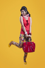 Portrait of retro woman with hand bag smiling