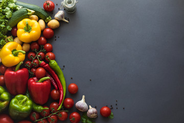 top view of various fresh ripe vegetables on grey background