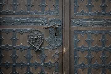 The old vintage door with handle and keyhole