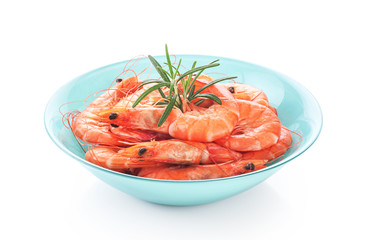 Fresh cooked shrimp on a plate isolated on white background.
