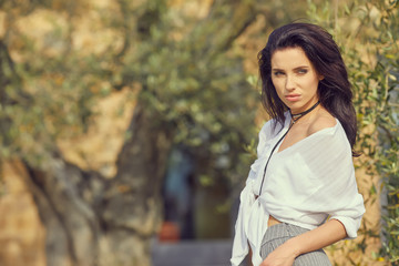 Beautiful woman resting in the summer the Italian garden