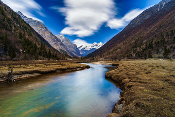 Landscape View stream and snow of Mountain in Siguniang National Park, Sichuan, China 