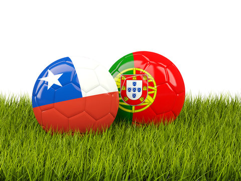 Chile and Portugal soccer balls on grass