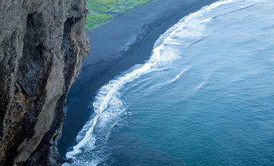 Black sand beach, Reynisfjara shore near the village Vik, atlantic ocean, Iceland