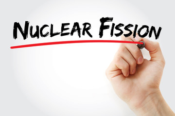 Hand writing Nuclear fission with marker, concept background