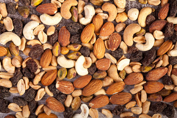Close up of Mix of healthy raw nuts on wooden background in studio photo. Healthy organic snack