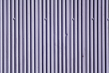 Blue color plaster wall texture with vertical pattern.
