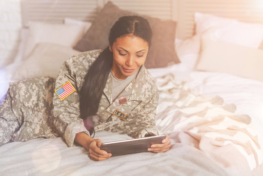 Beautiful military woman using a tablet