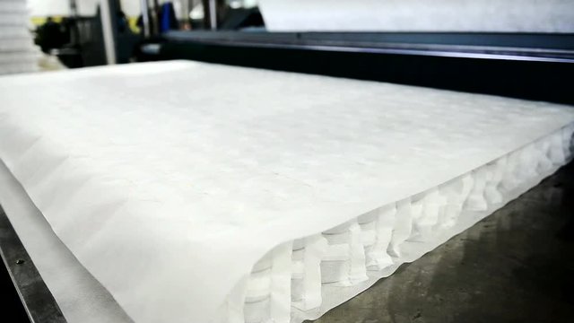 From the machine comes a mattress with connected blocks of independent springs. At the plant there is a mechanism for making orthopedic beds.