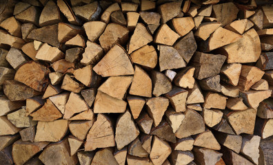 Chopped firewood woodpile close-up background