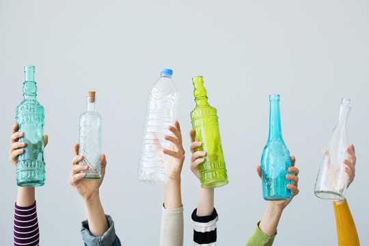 Hands holding glass bottle