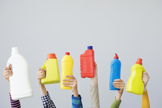 Hands Holding Colourful Plastic Bottle