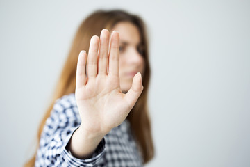 Woman showing stop gesture