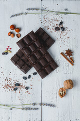 chocolate bar filled  lie on old wooden table with cracked paint