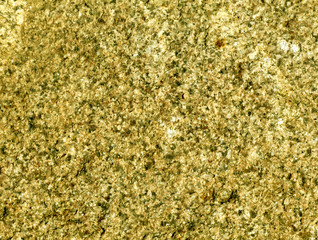 Yellow toned stone surface.