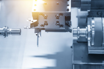 CNC lathe machine or Turning machine drilling  the steel rod .Hi technology manufacturing process.