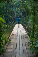 Fototapeta premium Walking on a suspension bridge in asia