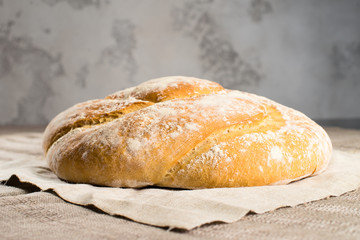 delicious baked good on a light textile background, capital bun