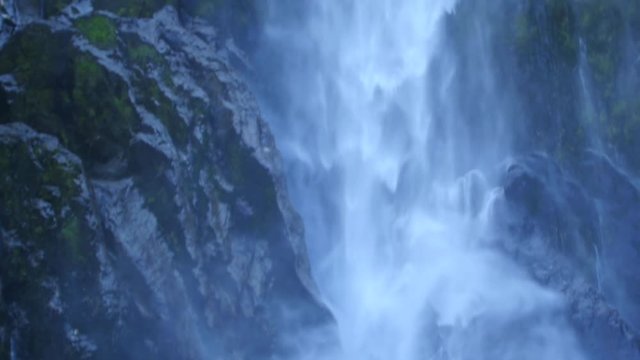 Tilt up, Milford Sound waterfall slow motion