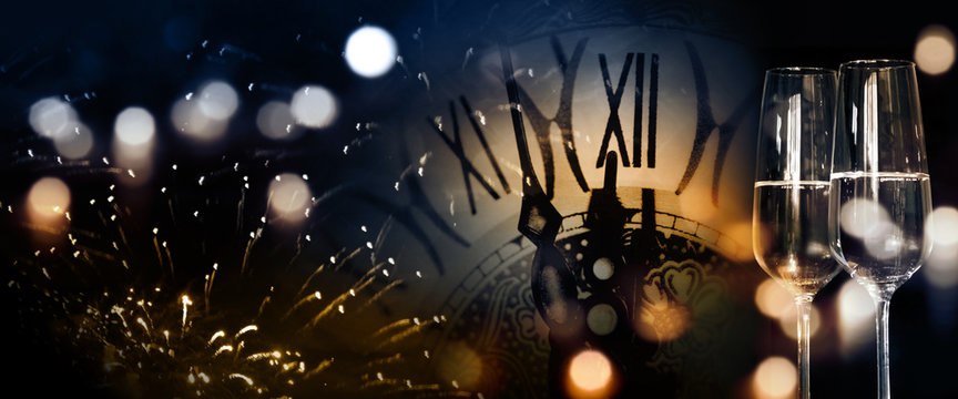 New Year background with fireworks and twelve o clock
