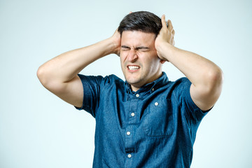 Frustrated man with headache isolated