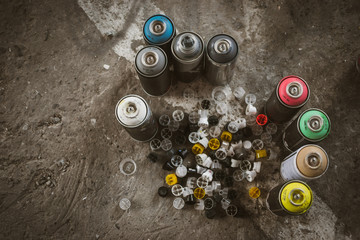 Aerosol spray bottles on the asphalt © sashafolly