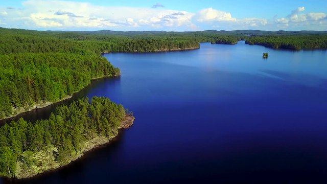 Aerial shot of beautiful islands at lake on a calm summer day. 4K video.