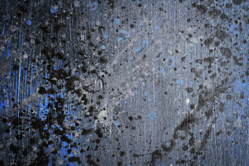 Hand painted splattered black, blue and grey wood grain texture background with acrylic paint splatter
