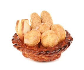 Braided bread basket with delicious buns on white background