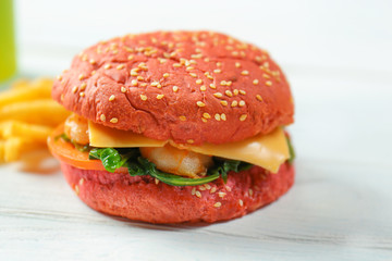 Delicious sandwich with shrimps on wooden table