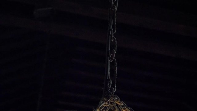 Old lamp in a small church of the seventeenth century