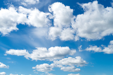 blue sky with white fluffy clouds, background