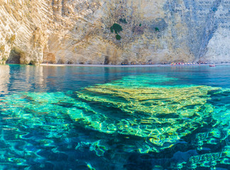 Clear water, rocks formations  of  Paradise beach, Ionian sea coast, Corfu island, Greece