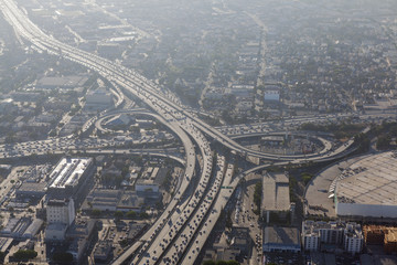 Smoggy afternoon aerial view of Harbor 110 and Santa Monica 10 freeways in downtown Los Angeles,...