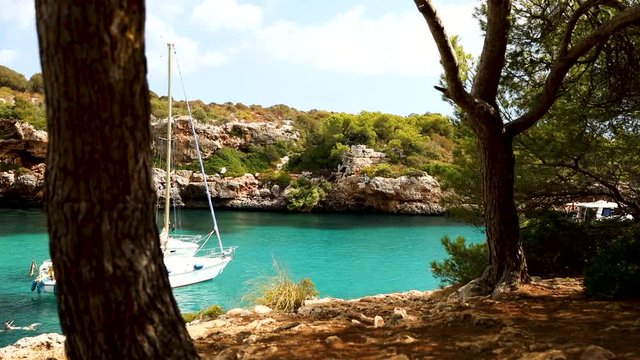 Yachting on sunny Cala Sa Nau, Mallorca, Spain