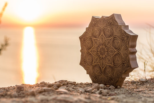Mandala with a beautiful sea and sunset background