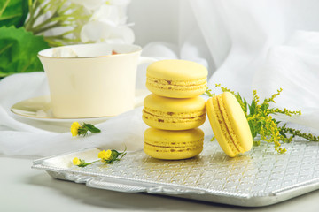 Fototapeta na wymiar Yellow banana macarons. French delicate dessert for Breakfast