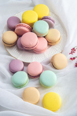 Colorful macarons on a white background. French dessert