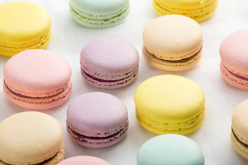Colorful macarons on a white background. French dessert