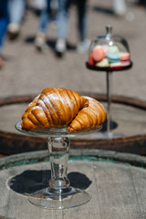Tasty fresh croissants on grey wooden background